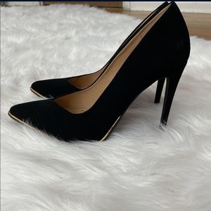 Black suede heels with gold trim